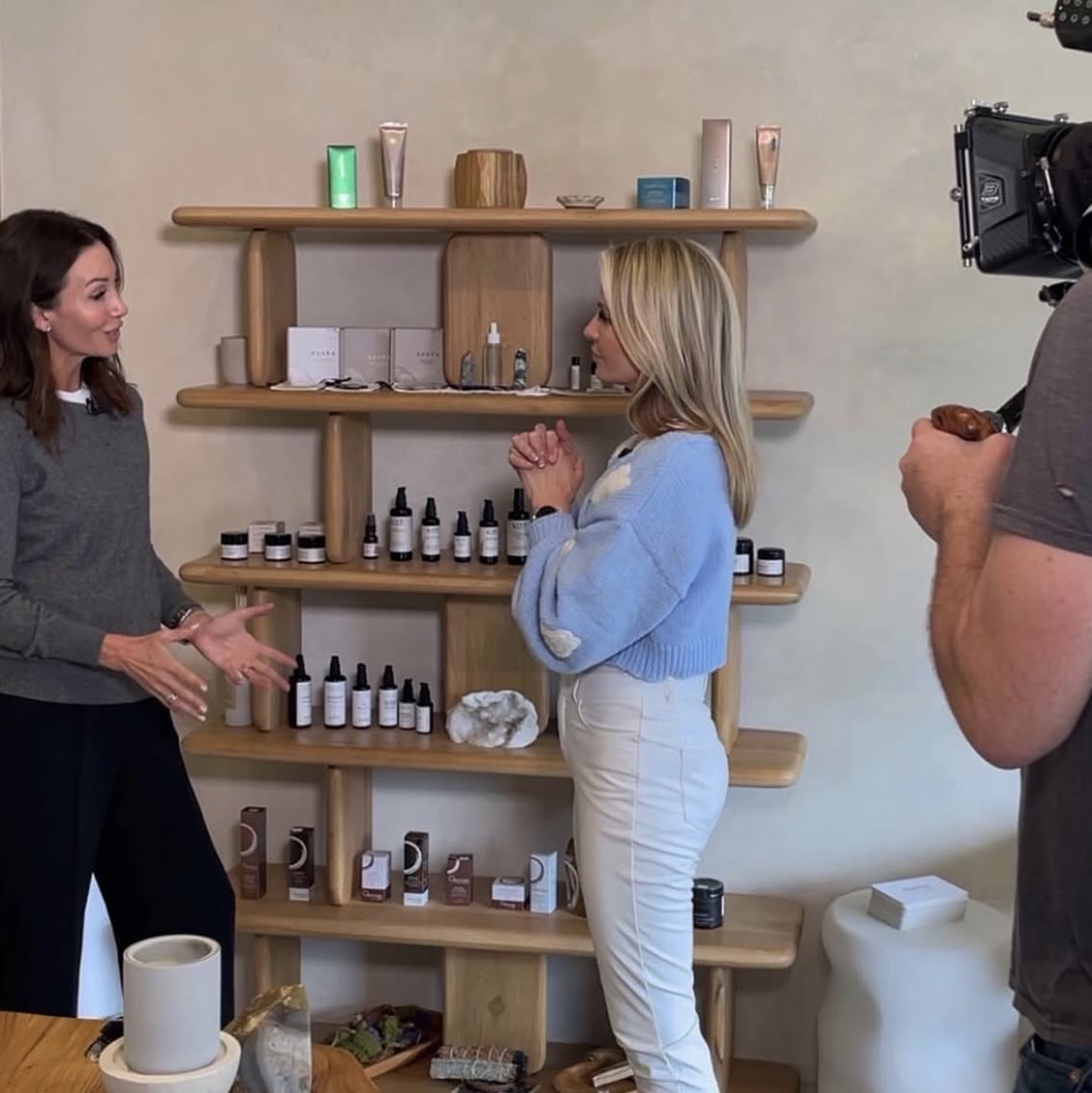 Amanda filming a segment in a clean beauty boutique